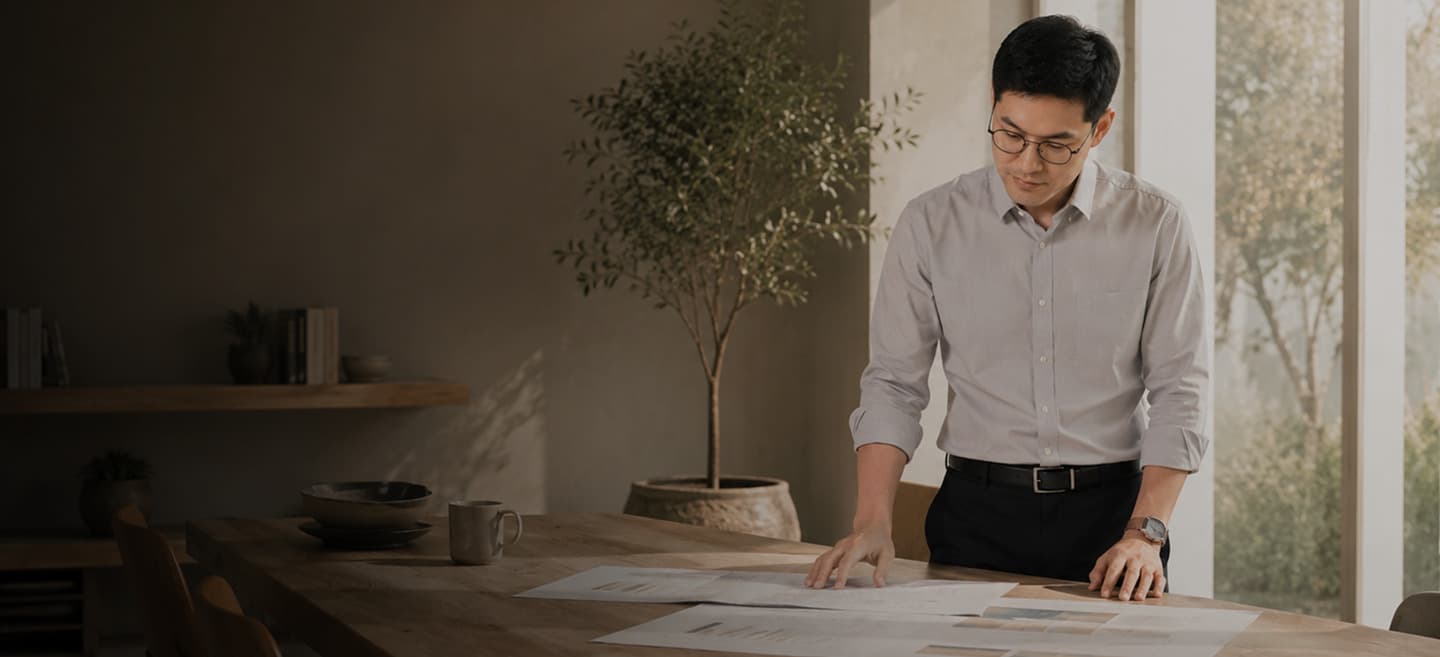Dr. Kim reviewing clinical notes at a table